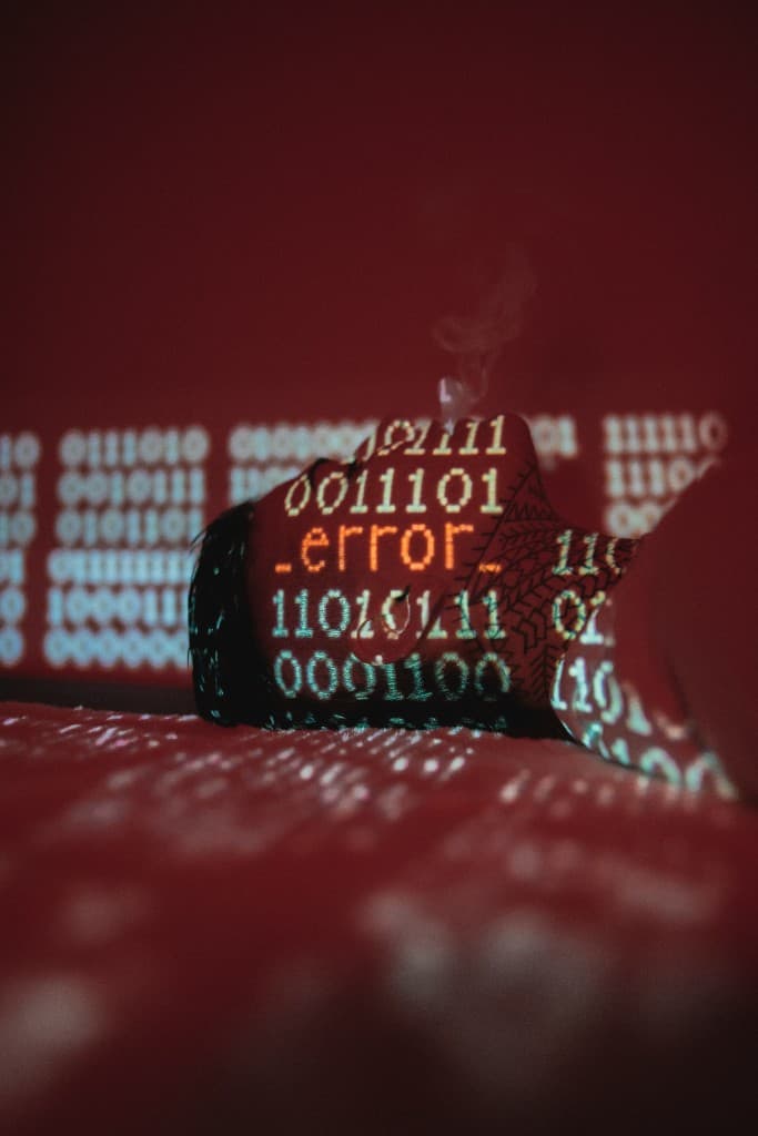 Person with binary code and the text .error_ projected across their face